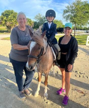Barb with a young rider on a pony and a helper